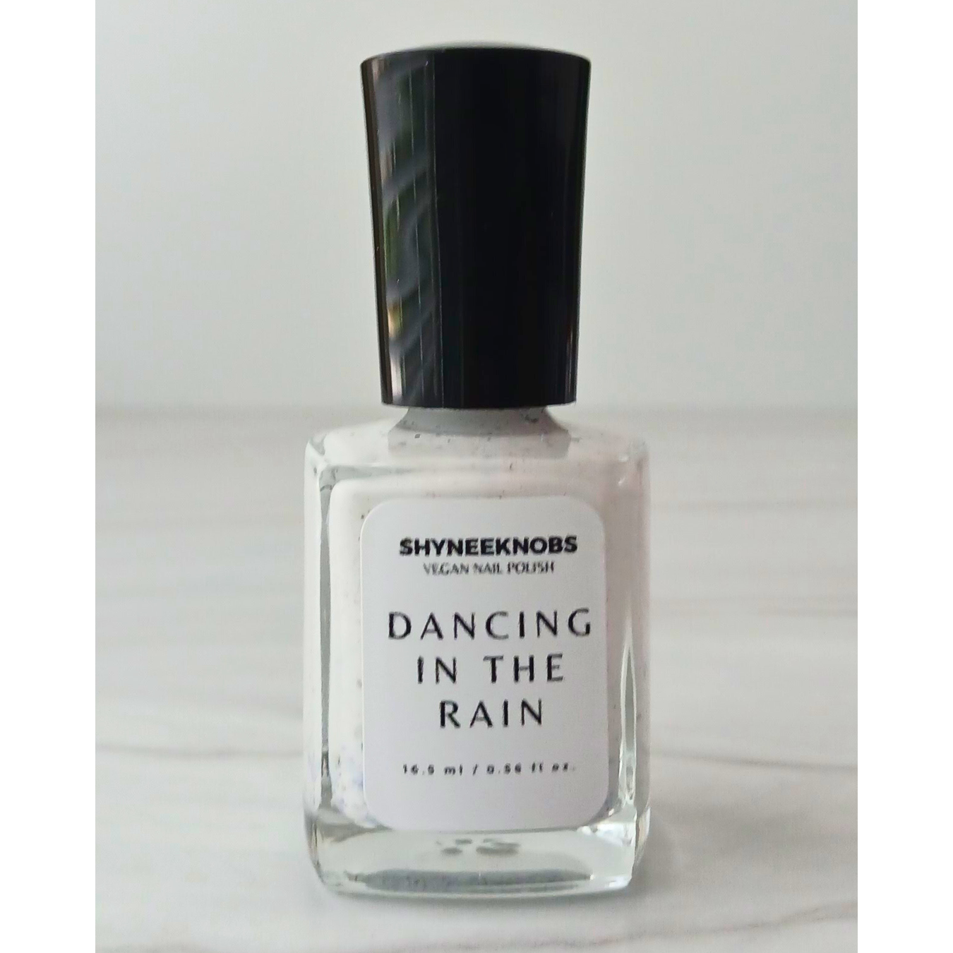 Dancing In The Rain (white with blue, silver, pink, and gold specks of glitter)